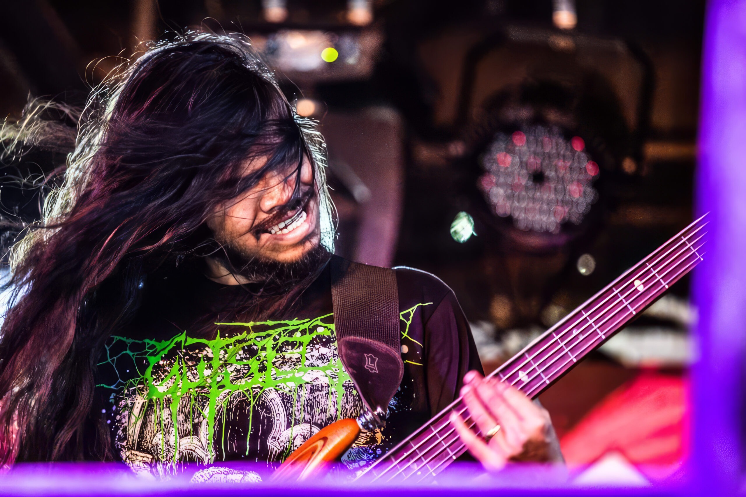 Picture of Ankit Kujur playing bass live on stage at the BIG69 festival in Mumbai.